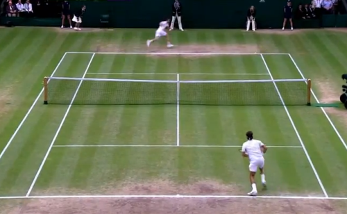 Murray chases the ball down while Federer moves forward