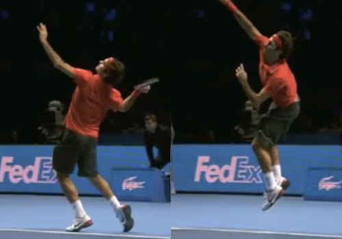 Federer jumping to hit a serve