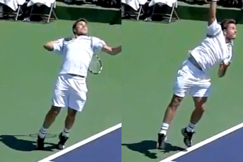 Wawrinka jumping to hit a serve