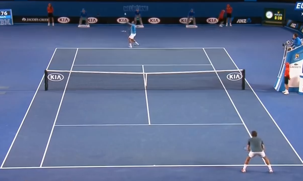 Federer waits to return Tsonga's serve on the deuce court