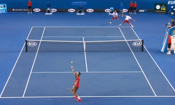 Wawrinka returns Nadal's serve on the ad court
